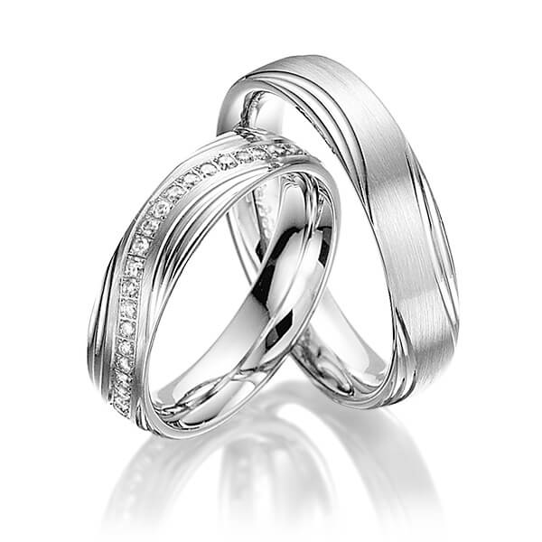 Paar klassische Memoire-Trauringe/Eheringe in Weißgold 375 halbausgefasst mit zus. 0,21 ct. Brillant tw, si von Steinberg - T-1100-3 Paar klassische Memoire-Trauringe/Eheringe in Weißgold 375 halbausgefasst mit zus. 0,21 ct. Brillant tw, si von Steinberg - T-1100-3