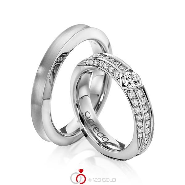 Set klassieke trouwringen in grijsgoud 14 kt. met 0,3 ct. + in totaal 0,902 ct. Briljant tw/si van acredo - A-1117-4 Set klassieke trouwringen in grijsgoud 14 kt. met 0,3 ct. + in totaal 0,902 ct. Briljant tw/si van acredo - A-1117-4