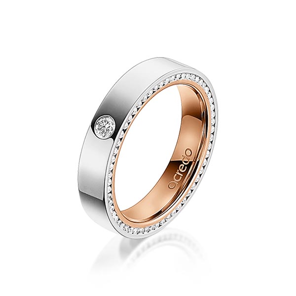 Bicolor trouwring in buiten grijsgoud 14 kt. , binnen roodgoud 14 kt. met in totaal 0,395 ct. Briljant tw/si van acredo
