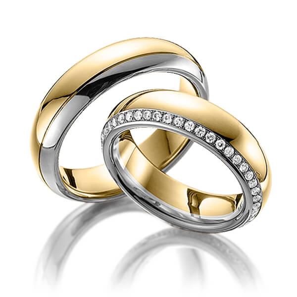 Paar bicolor Memoire-Trauringe/Eheringe in Gelbgold 585 Graugold dunkel 585 vollausgefasst mit zus. 0,47 ct. Brillant tw, si von Steinberg