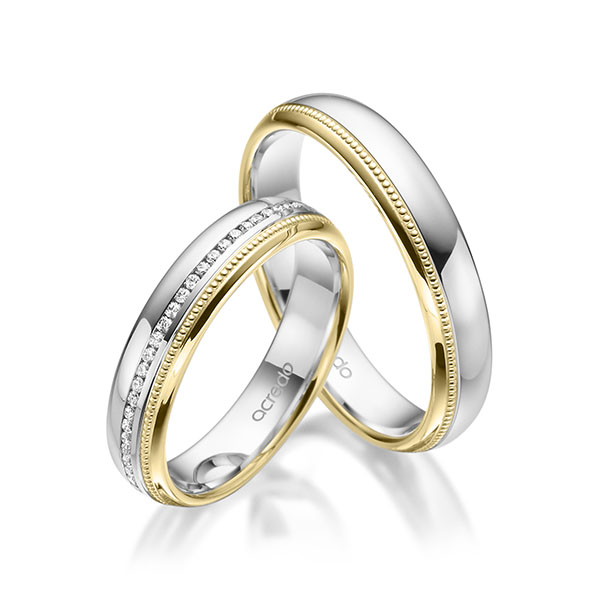 Paar bicolor Memoire-Trauringe/Eheringe in Weissgold 585 Gelbgold 585 vollausgefasst mit zus. 0,295 ct. Brillant tw, si von acredo