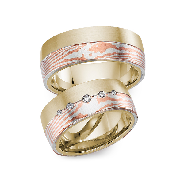 Paar bicolor Trauringe/Eheringe in Gelbgold 585 Mokume Gane Silber 925 Kupfer mit zus. 0,09 ct. Brillant tw, si 