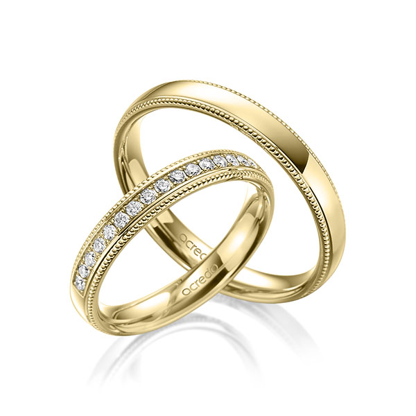 Paar klassische Memoire-Trauringe/Eheringe in Gelbgold 585 halbausgefasst mit zus. 0,285 ct. Brillant tw, si von acredo