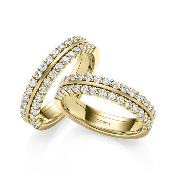 Paar klassische Memoire-Trauringe/Eheringe in Gelbgold 585 halbausgefasst mit zus. 1,2 ct. tw, si von acredo