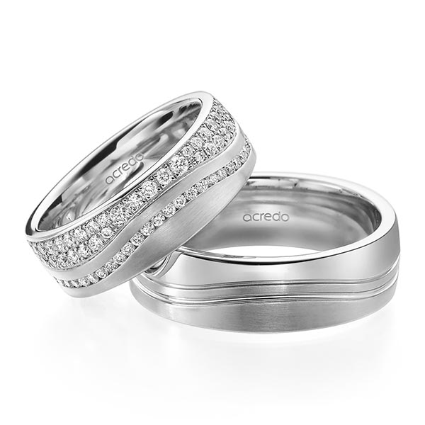 Paar klassische Memoire-Trauringe/Eheringe in Graugold 585 vollausgefasst mit zus. 1,085 ct. Brillant tw, si von acredo