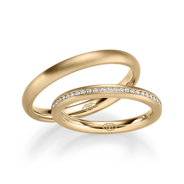 Paar klassische Memoire-Trauringe/Eheringe in Roségold 585 halbausgefasst mit zus. 0,22 ct. Brillant tw, si 