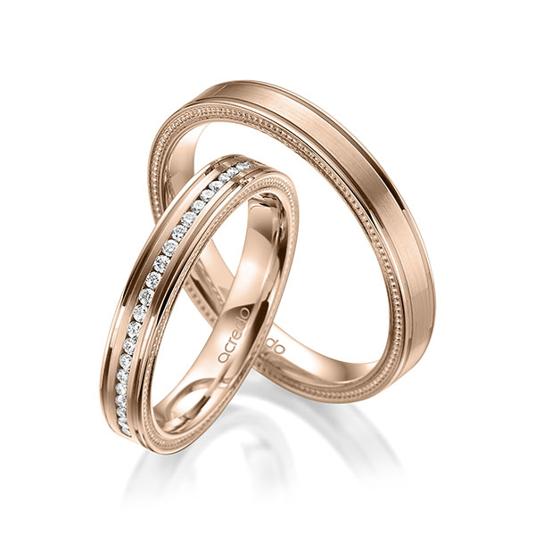 Paar klassische Memoire-Trauringe/Eheringe in Rotgold 585 halbausgefasst mit zus. 0,192 ct. Brillant tw, si von acredo