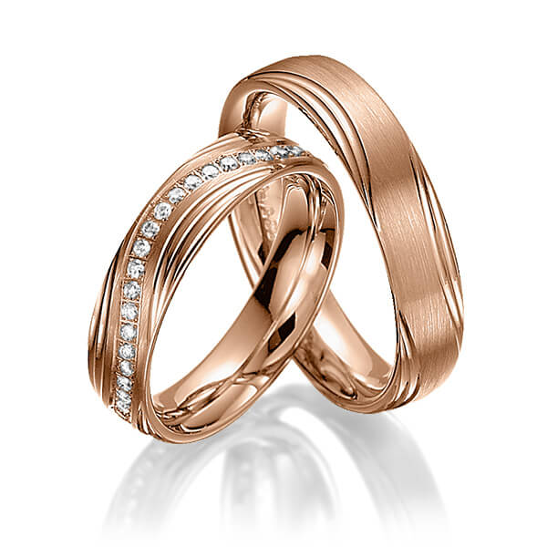 Paar klassische Memoire-Trauringe/Eheringe in Rotgold 585 halbausgefasst mit zus. 0,21 ct. Brillant tw, si von Steinberg