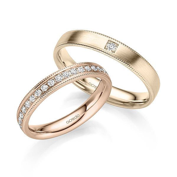 Paar klassische Memoire-Trauringe/Eheringe in Rotgold 585 halbausgefasst mit zus. 0,31 ct. Brillant tw, si von acredo