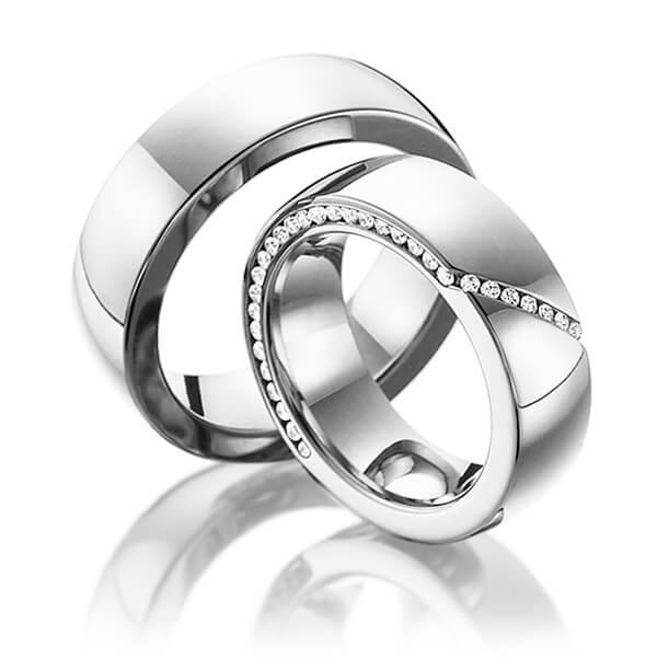 Paar klassische Memoire-Trauringe/Eheringe in Weissgold 585 halbausgefasst mit zus. 0,29 ct. Brillant tw, si von Steinberg