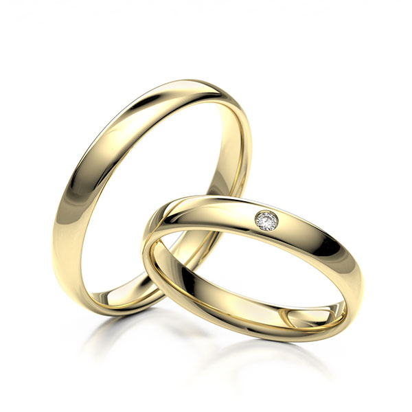 Paar klassische Trauringe/Eheringe in Gelbgold 375 mit zus. 0,02 ct. Brillant tw, si 