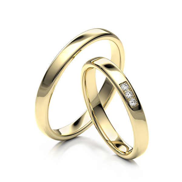 Paar klassische Trauringe/Eheringe in Gelbgold 375 mit zus. 0,045 ct. Brillant tw, si 