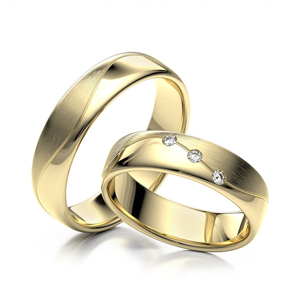 Paar klassische Trauringe/Eheringe in Gelbgold 375 mit zus. 0,06 ct. Brillant tw, vs 