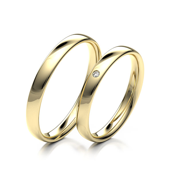 Paar klassische Trauringe/Eheringe in Gelbgold 585 mit zus. 0,01 ct. Brillant tw, si 