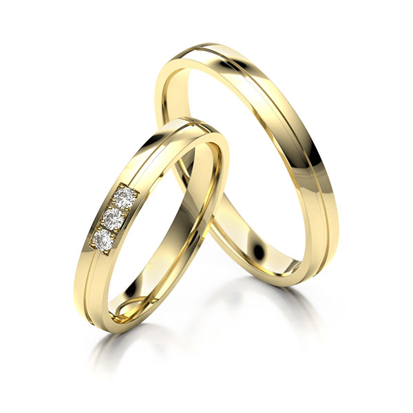 Paar klassische Trauringe/Eheringe in Gelbgold 585 mit zus. 0,045 ct. Brillant tw, si 