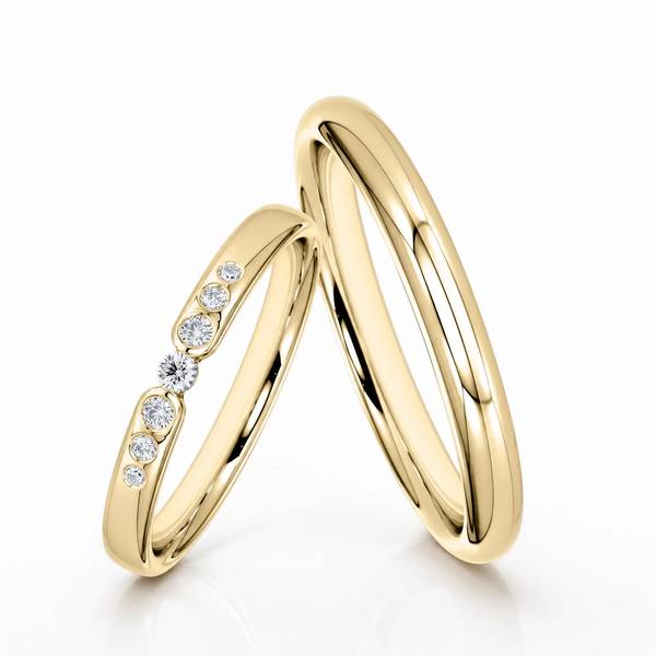 Paar klassische Trauringe/Eheringe in Gelbgold 585 mit zus. 0,081 ct. Brillant von Steinberg