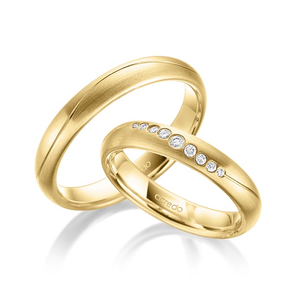 Paar klassische Trauringe/Eheringe in Gelbgold 585 mit zus. 0,101 ct. Brillant tw, si von acredo