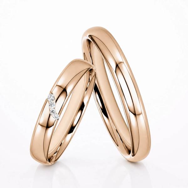 Paar klassische Trauringe/Eheringe in Peach-Gold 585 mit zus. 0,03 ct. Brillant von Steinberg