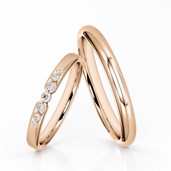 Paar klassische Trauringe/Eheringe in Peach-Gold 585 mit zus. 0,081 ct. Brillant von Steinberg
