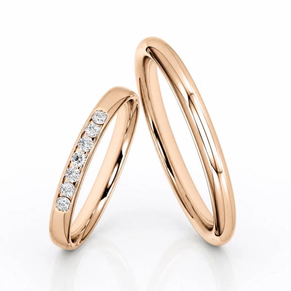 Paar klassische Trauringe/Eheringe in Peach-Gold 585 mit zus. 0,14 ct. Brillant von Steinberg