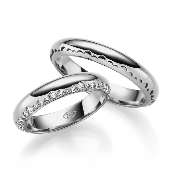 Paar klassische Trauringe/Eheringe in Platin 600 mit zus. 0,6 ct. Brillant tw, si 