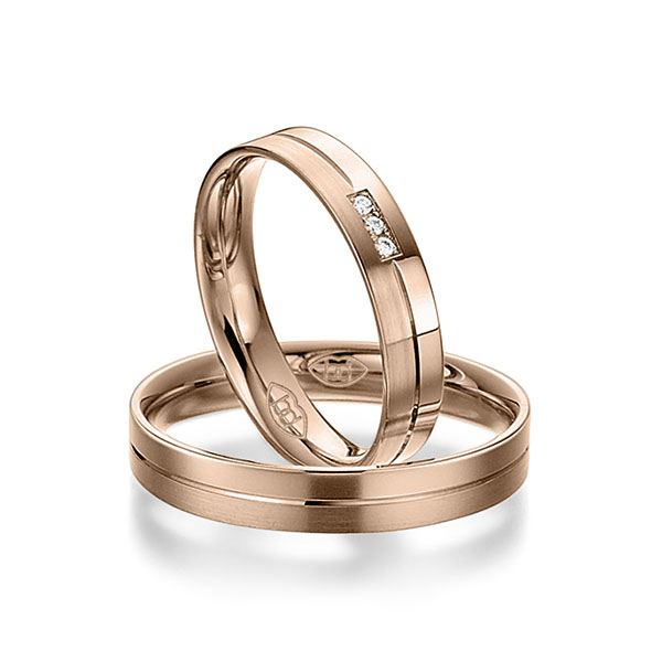 Paar klassische Trauringe/Eheringe in Rotgold 375 mit zus. 0,024 ct. Brillant tw, si 