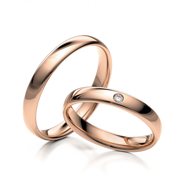 Paar klassische Trauringe/Eheringe in Rotgold 375 mit zus. 0,02 ct. Brillant tw, si 