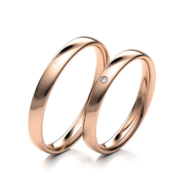 Paar klassische Trauringe/Eheringe in Rotgold 585 mit zus. 0,01 ct. Brillant tw, si 