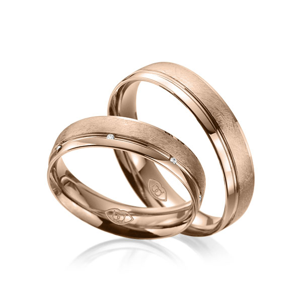 Paar klassische Trauringe/Eheringe in Rotgold 585 mit zus. 0,035 ct. Brillant tw, si 