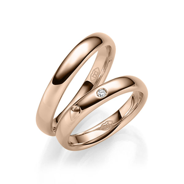 Paar klassische Trauringe/Eheringe in Rotgold 585 mit zus. 0,03 ct. Brillant tw, si 
