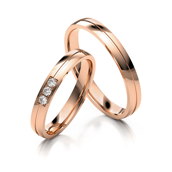 Paar klassische Trauringe/Eheringe in Rotgold 585 mit zus. 0,045 ct. Brillant tw, si 