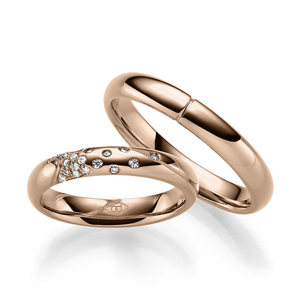 Paar klassische Trauringe/Eheringe in Rotgold 585 mit zus. 0,111 ct. Brillant tw, si 