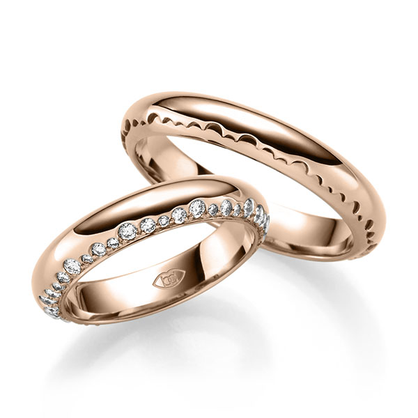 Paar klassische Trauringe/Eheringe in Rotgold 585 mit zus. 0,6 ct. Brillant tw, si 