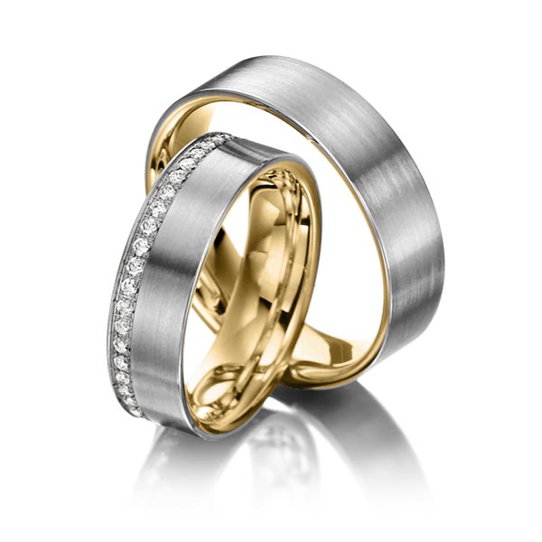 Set Bicolor Memoire-trouwringen in buiten dark grey gold 14 kt. , binnen geelgoud 14 kt. half gezet met in totaal 0,23 ct. Briljant tw/si van Steinberg