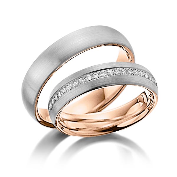 Set Bicolor Memoire-trouwringen in buiten dark grey gold 14 kt. , binnen roodgoud 14 kt. half gezet met in totaal 0,23 ct. Briljant tw/si van Steinberg
