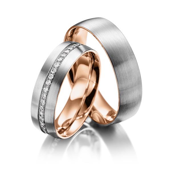 Set Bicolor Memoire-trouwringen in buiten dark grey gold 14 kt. , binnen roodgoud 14 kt. half gezet met in totaal 0,23 ct. Briljant tw/si van Steinberg
