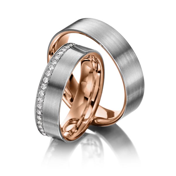 Set Bicolor Memoire-trouwringen in buiten dark grey gold 14 kt. , binnen roodgoud 14 kt. half gezet met in totaal 0,23 ct. Briljant tw/si van Steinberg