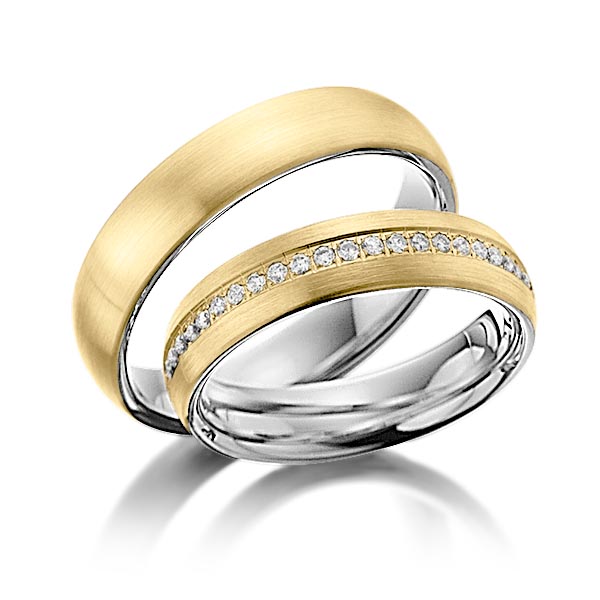 Set Bicolor Memoire-trouwringen in buiten geelgoud 14 kt. , binnen dark grey gold 14 kt. half gezet met in totaal 0,23 ct. Briljant tw/si van Steinberg