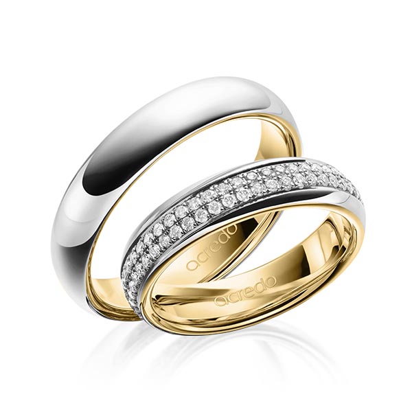 Set Bicolor Memoire-trouwringen in buiten grijsgoud 14 kt. , binnen geelgoud 14 kt. volledig gezet met in totaal 0,768 ct. Briljant tw/si van acredo