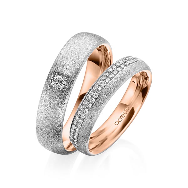 Set Bicolor Memoire-trouwringen in buiten grijsgoud 14 kt. , binnen roodgoud 14 kt. half gezet met in totaal 0,36 ct. Briljant tw/si van acredo