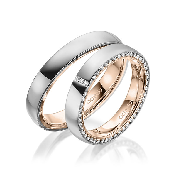 Set Bicolor Memoire-trouwringen in buiten grijsgoud 14 kt. , binnen roodgoud 14 kt. volledig gezet met in totaal 0,279 ct. Briljant tw/si van acredo - A-1939-3 Set Bicolor Memoire-trouwringen in buiten grijsgoud 14 kt. , binnen roodgoud 14 kt. volledig gezet met in totaal 0,279 ct. Briljant tw/si van acredo - A-1939-3