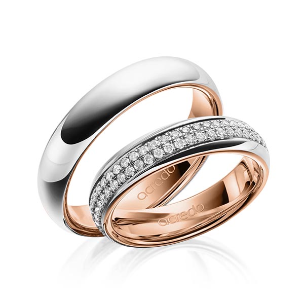 Set Bicolor Memoire-trouwringen in buiten platina 950 , binnen roodgoud 18 kt. volledig gezet met in totaal 0,768 ct. Briljant tw/si van acredo