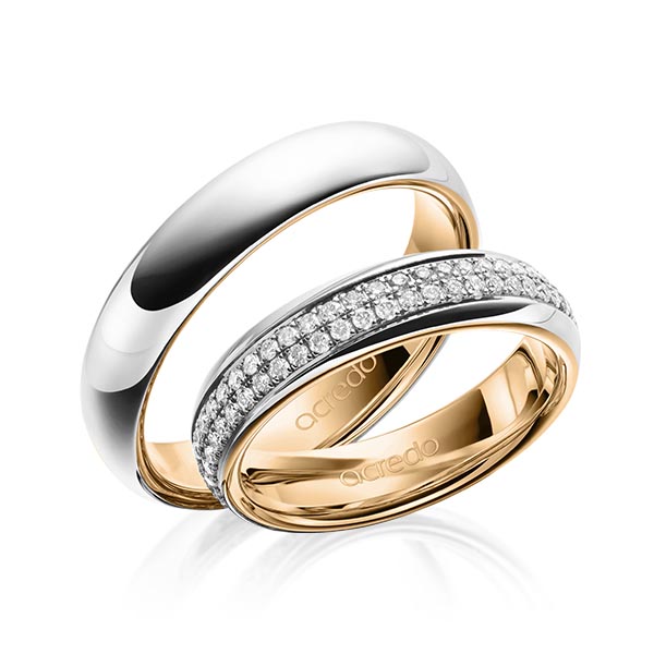Set Bicolor Memoire-trouwringen in buiten platina 950 , binnen roségoud 18 kt. volledig gezet met in totaal 0,768 ct. Briljant tw/si van acredo