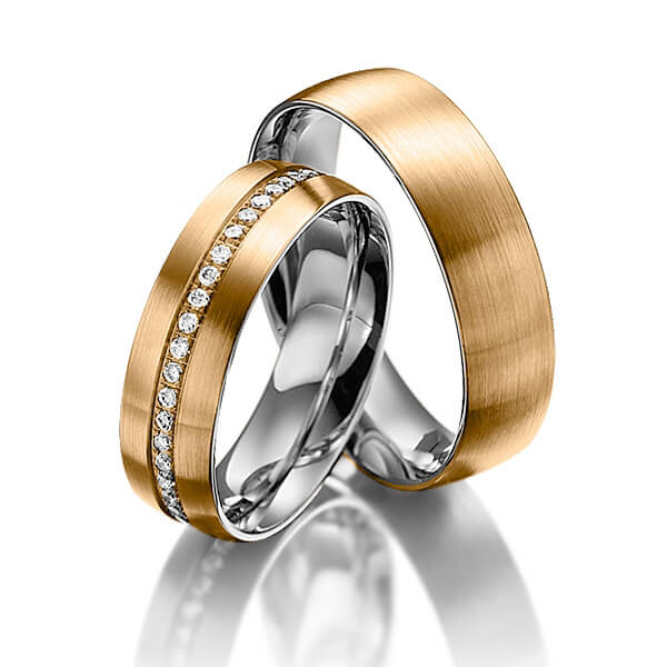 Set Bicolor Memoire-trouwringen in buiten roségoud 14 kt. , binnen dark grey gold 14 kt. half gezet met in totaal 0,23 ct. Briljant tw/si van Steinberg