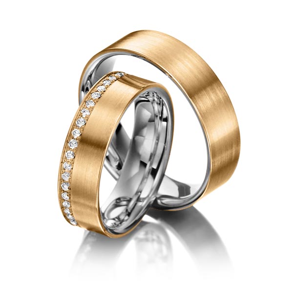 Set Bicolor Memoire-trouwringen in buiten roségoud 14 kt. , binnen dark grey gold 14 kt. half gezet met in totaal 0,23 ct. Briljant tw/si van Steinberg