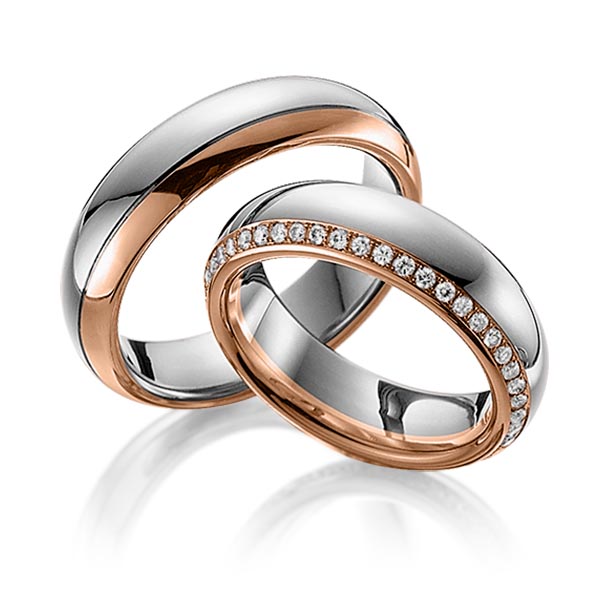 Set Bicolor Memoire-trouwringen in dark grey gold 14 kt. roodgoud 14 kt. volledig gezet met in totaal 0,47 ct. Briljant tw/si van Eternal Touch