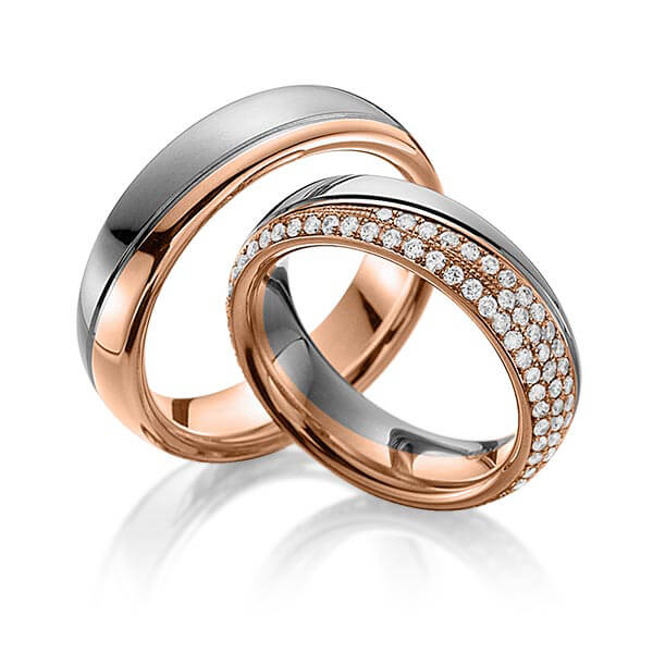 Set Bicolor Memoire-trouwringen in dark grey gold 14 kt. roodgoud 14 kt. volledig gezet met in totaal 0,85 ct. Briljant tw,vs van Eternal Touch