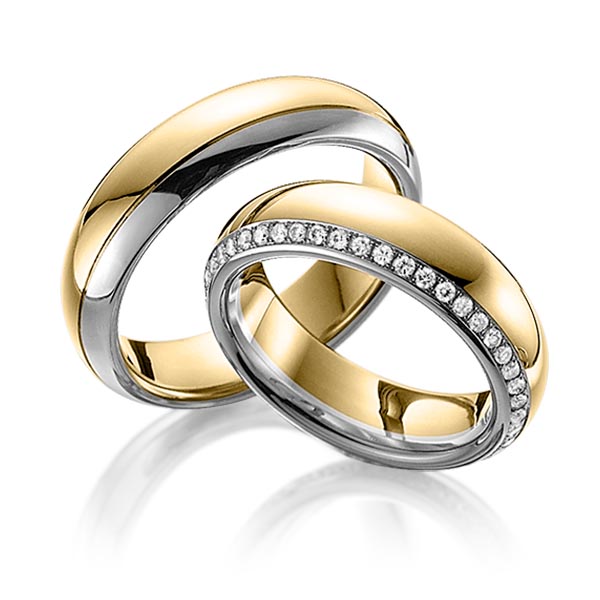 Set Bicolor Memoire-trouwringen in geelgoud 14 kt. dark grey gold 14 kt. volledig gezet met in totaal 0,47 ct. Briljant tw/si van Eternal Touch