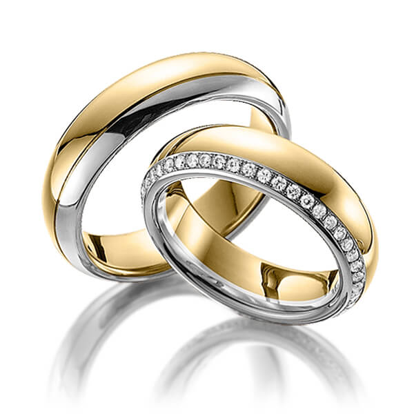 Set Bicolor Memoire-trouwringen in geelgoud 14 kt. grijsgoud 14 kt. volledig gezet met in totaal 0,47 ct. Briljant tw/si van Steinberg