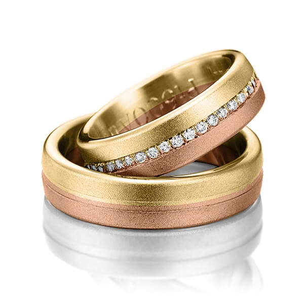 Set Bicolor Memoire-trouwringen in geelgoud 14 kt. roodgoud 14 kt. half gezet met in totaal 0,22 ct. Briljant tw/si van Steinberg